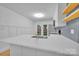 Bright kitchen with stainless steel appliances, white cabinets and view of back patio at 7328 Starvalley Dr, Charlotte, NC 28210