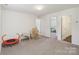 Spacious bonus room with neutral carpet, white walls, and ample space for entertaining at 804 Yorkshire Dr, Albemarle, NC 28001