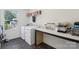 Functional laundry room with washer, dryer, folding counter, and storage shelves at 804 Yorkshire Dr, Albemarle, NC 28001