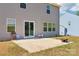 Concrete patio featuring a sliding glass door and large windows at 804 Yorkshire Dr, Albemarle, NC 28001