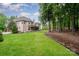 Spacious backyard with lush green grass, trees, and a well-manicured lawn at 925 Giacomo Dr, Waxhaw, NC 28173