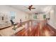 Spacious basement with hardwood floors, exercise equipment, and a ping pong table at 925 Giacomo Dr, Waxhaw, NC 28173