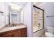 Bathroom with granite countertop vanity, toilet, tub/shower combo with glass doors at 925 Giacomo Dr, Waxhaw, NC 28173