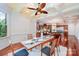 Open dining area with cherry floors, coffered ceiling, and access to kitchen at 925 Giacomo Dr, Waxhaw, NC 28173