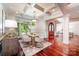 Elegant dining room with cherry floors, coffered ceilings, and arched wooden doorway at 925 Giacomo Dr, Waxhaw, NC 28173