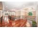 Spacious foyer with hardwood floors, coffered ceilings, wrought iron railings, and elegant chandeliers at 925 Giacomo Dr, Waxhaw, NC 28173