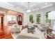 Spacious living room features cherry floors, large windows, and neutral furniture at 925 Giacomo Dr, Waxhaw, NC 28173