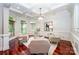 Bright living room boasts cherry floors, coffered ceilings, and comfortable seating at 925 Giacomo Dr, Waxhaw, NC 28173