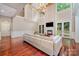 Bright living room with fireplace, hardwood floors, and high ceilings at 925 Giacomo Dr, Waxhaw, NC 28173
