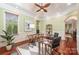 Stylish home office with cherry floors, modern desk, and neutral walls at 925 Giacomo Dr, Waxhaw, NC 28173