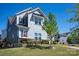 Two-story home with stone accents and a manicured lawn, offering charming curb appeal at 990 Nw Capwalk Nw Rd # 138, Concord, NC 28027