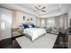 Bright main bedroom suite with tray ceilings and a seating area at 990 Nw Capwalk Nw Rd # 138, Concord, NC 28027