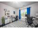 Well-lit home office with desk, shelving, and bright blue accents at 990 Nw Capwalk Nw Rd # 138, Concord, NC 28027