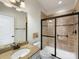 Bathroom featuring a tiled shower with glass door and granite countertops at 10716 Meg Meadow Dr, Mint Hill, NC 28227