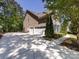 Home exterior featuring an attached two-car garage and long driveway at 10716 Meg Meadow Dr, Mint Hill, NC 28227