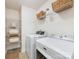 Laundry room with washer, dryer, wire shelving, and tile floors at 10716 Meg Meadow Dr, Mint Hill, NC 28227