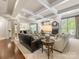 Spacious living room with coffered ceilings, a fireplace, and open access to the kitchen at 10716 Meg Meadow Dr, Mint Hill, NC 28227