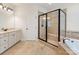 Main bathroom with shower, soaking tub, and granite countertops at 10716 Meg Meadow Dr, Mint Hill, NC 28227