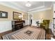 Charming piano room with hardwood floors, neutral walls, and a Yamaha piano at 10716 Meg Meadow Dr, Mint Hill, NC 28227