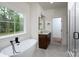 Stylish bathroom with a soaking tub, walk-in shower, and updated fixtures at 108 Woodwinds St, Locust, NC 28097