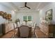 Elegant dining room featuring a large table, stylish chairs, and ample natural light at 108 Woodwinds St, Locust, NC 28097