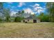 Charming single-story home featuring a spacious yard, attached garage and a private driveway, surrounded by mature trees at 108 Woodwinds St, Locust, NC 28097