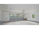 Spacious two-car garage with high ceilings, ample storage space, and a bright, clean interior at 108 Woodwinds St, Locust, NC 28097