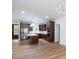 Spacious kitchen with a center island, stainless appliances, and dark wood cabinets at 108 Woodwinds St, Locust, NC 28097
