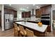 Modern kitchen with stainless steel appliances, quartz countertops, and custom cabinetry at 108 Woodwinds St, Locust, NC 28097