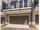 Two-car garage with door and exterior showing the street number of the home at 1112 Bismuth Ln, Charlotte, NC 28211