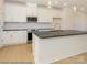 Modern kitchen with stainless steel appliances, granite countertops, and hardwood floors at 1112 Bismuth Ln, Charlotte, NC 28211