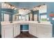 Well-lit bathroom with dual sink vanity, modern fixtures, and ample counter space at 125 N Wendover Trce, Mooresville, NC 28117