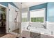 Elegant bathroom featuring a soaking tub and a separate glass-enclosed shower at 125 N Wendover Trce, Mooresville, NC 28117