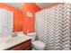 Cozy bathroom featuring modern fixtures and orange walls at 125 N Wendover Trce, Mooresville, NC 28117