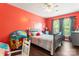 Charming bedroom with playful decor, hardwood flooring, and ample natural light at 125 N Wendover Trce, Mooresville, NC 28117