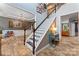 Grand foyer with hardwood floors, staircase, chandelier, and decorative accents, offering a warm welcome at 125 N Wendover Trce, Mooresville, NC 28117