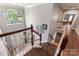 Spacious foyer with dark wood flooring, light gray paint, modern lighting, and white trim at 125 N Wendover Trce, Mooresville, NC 28117