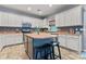 Modern kitchen featuring white cabinetry, an island with seating, and stainless steel appliances at 125 N Wendover Trce, Mooresville, NC 28117