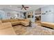 Spacious living room offering tiled floors, a comfortable sectional, and seamless flow to the kitchen at 125 N Wendover Trce, Mooresville, NC 28117