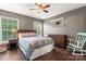 Charming main bedroom with hardwood floors, side tables, dressers and lots of natural light at 125 N Wendover Trce, Mooresville, NC 28117