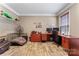 Home office with wood flooring, a large desk, shelving, and a comfortable chair, perfect for remote work at 125 N Wendover Trce, Mooresville, NC 28117