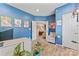 Bright and spacious home office featuring natural light, tiled floors and inviting seating area at 125 N Wendover Trce, Mooresville, NC 28117