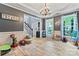 Spacious playroom with beautiful hardwood floors, chandelier and plenty of room to play at 125 N Wendover Trce, Mooresville, NC 28117