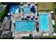Aerial view of community pools featuring clear blue water, sun loungers, and umbrellas at 13237 Fremington Rd, Huntersville, NC 28078
