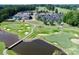 Picturesque golf course with lush greens, sand traps, a water feature and clubhouse at 13237 Fremington Rd, Huntersville, NC 28078