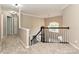 An upstairs hallway with carpeted floors and crown molding at 13237 Fremington Rd, Huntersville, NC 28078