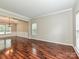 Spacious living room with hardwood floors, crown molding and bright windows at 13237 Fremington Rd, Huntersville, NC 28078