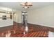 Open living room and hallway featuring shiny hardwood floors and neutral paint at 13237 Fremington Rd, Huntersville, NC 28078