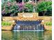 Stunning Northstone Country Club entrance with stone waterfall and landscaping at 13237 Fremington Rd, Huntersville, NC 28078