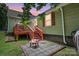 Backyard featuring a patio with a fire pit and a deck for outdoor relaxation at 139 5Th St, Huntersville, NC 28078